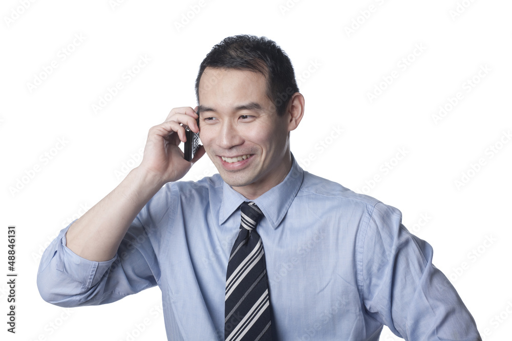 Chinese businessman talking on cell phone Chinese businessman talking on cell phone