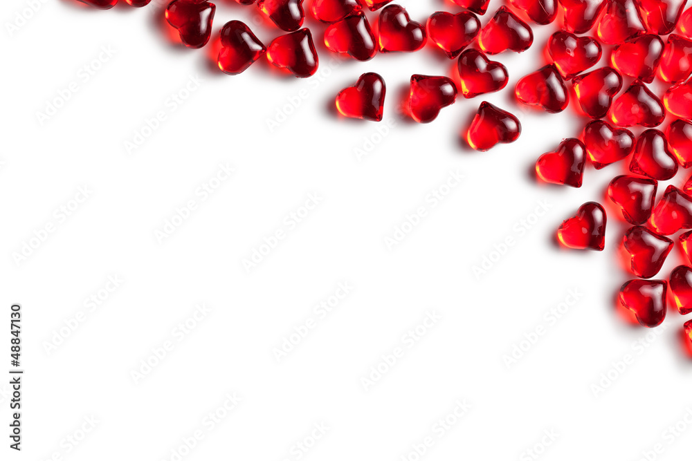 red glass hearts on white background