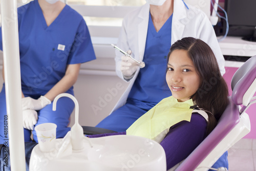 Teenage girl happy to visit the dentist