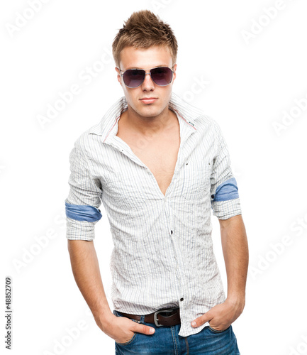 Fashion shot of an elegant young man in sunglasses