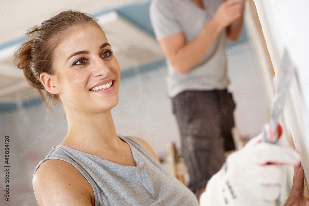 Fototapeta premium Attractive woman renewing house