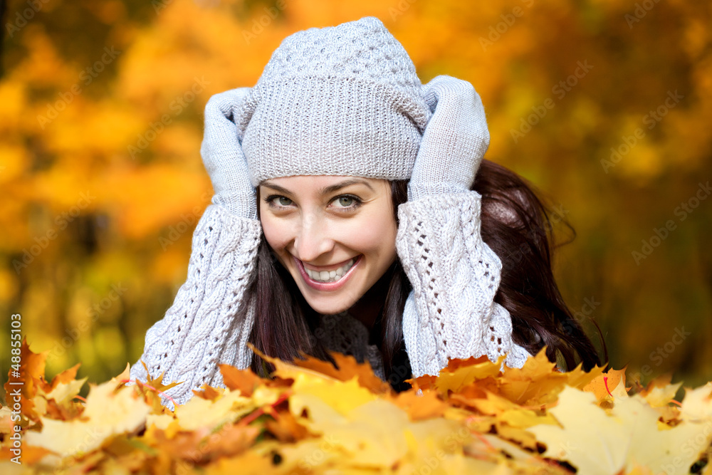 pretty woman is lying in a yellow autumn leaves pretty woman is lying in a yellow autumn leaves