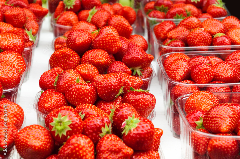 Fresh strawberries for sale in plastic containers Fresh strawberries for sale in plastic containers