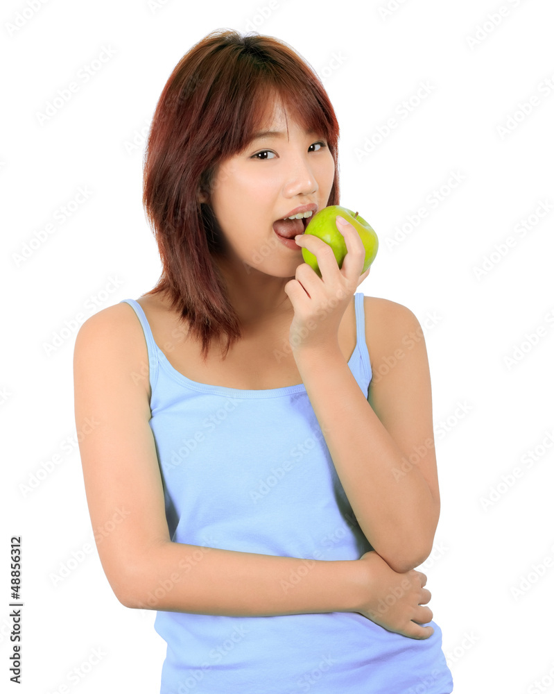Isolated young asian woman with a green apple. Isolated young asian woman with a green apple.
