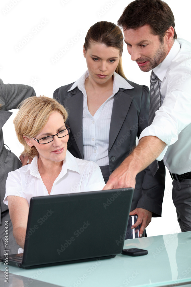 Fototapeta premium Business people around laptop