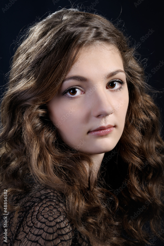 Fototapeta premium Girl with long curly hair.