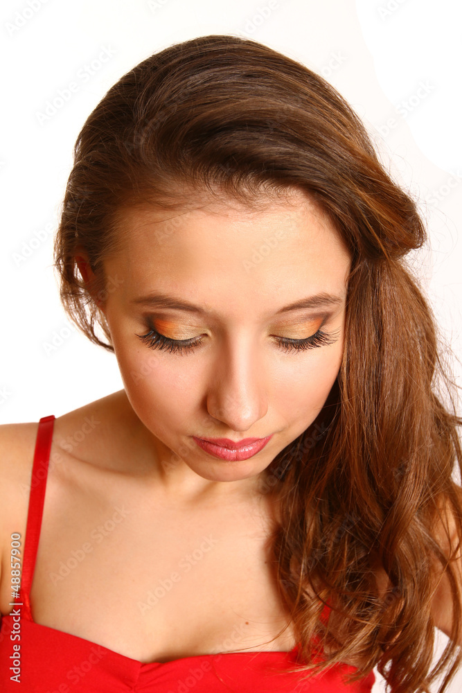 Girl with makeup looking down isolated on white background Girl with makeup looking down isolated on white background