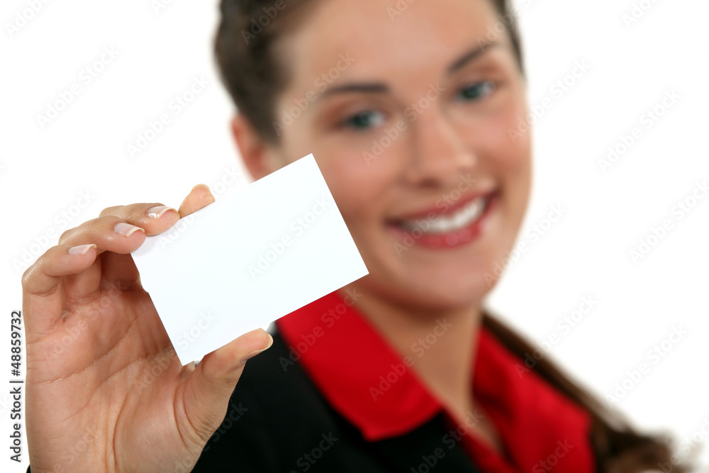 A businesswoman handing her card. A businesswoman handing her card.