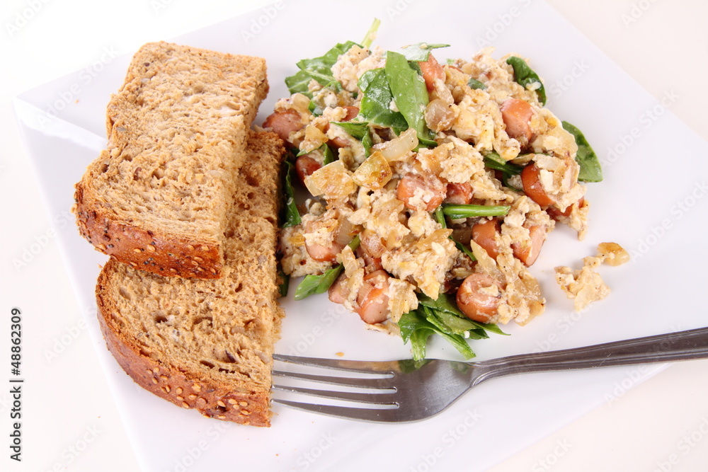 Scrambled eggs with frankfurters and spinach Scrambled eggs with frankfurters and spinach