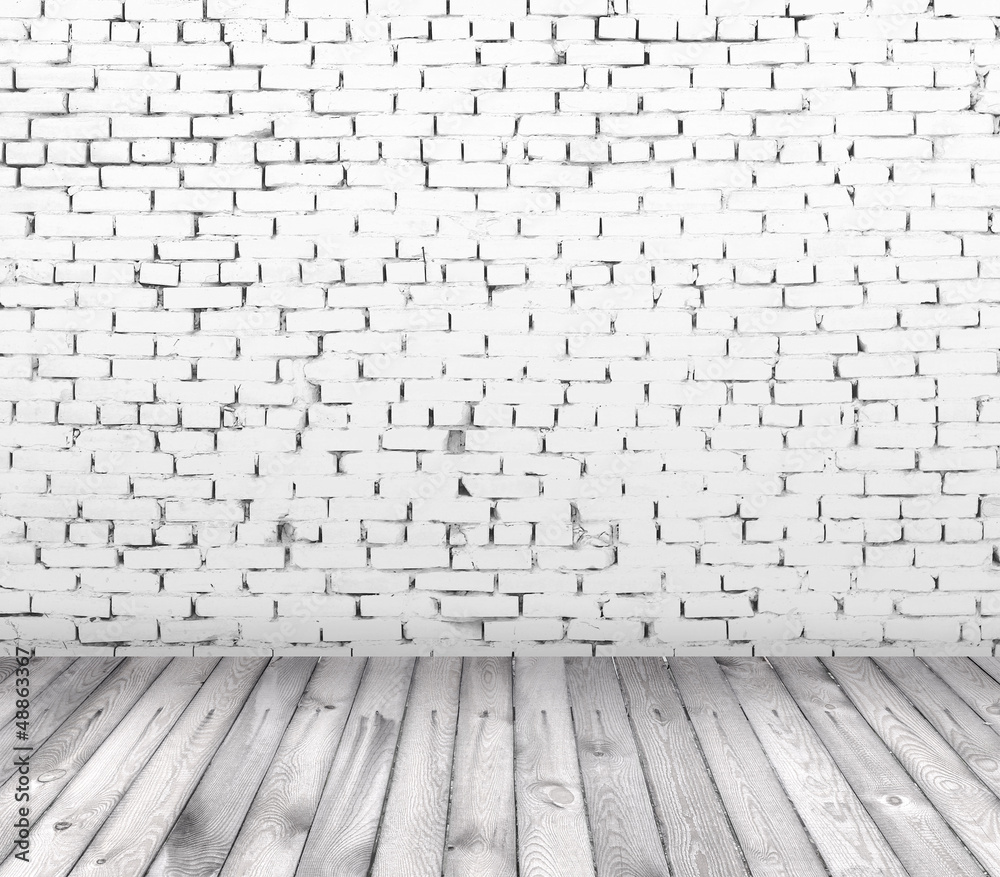 interior room with white brick wall and wooden floor interior room with white brick wall and wooden floor