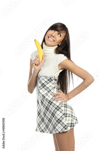 Positive attractive girl playing with banana