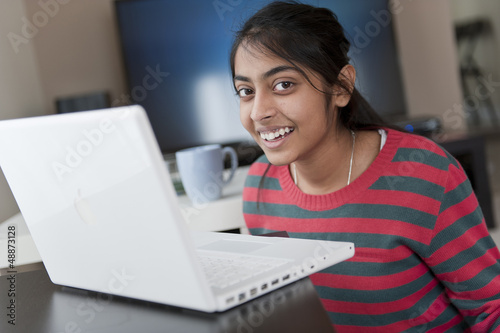 Indian girl working with laptop
