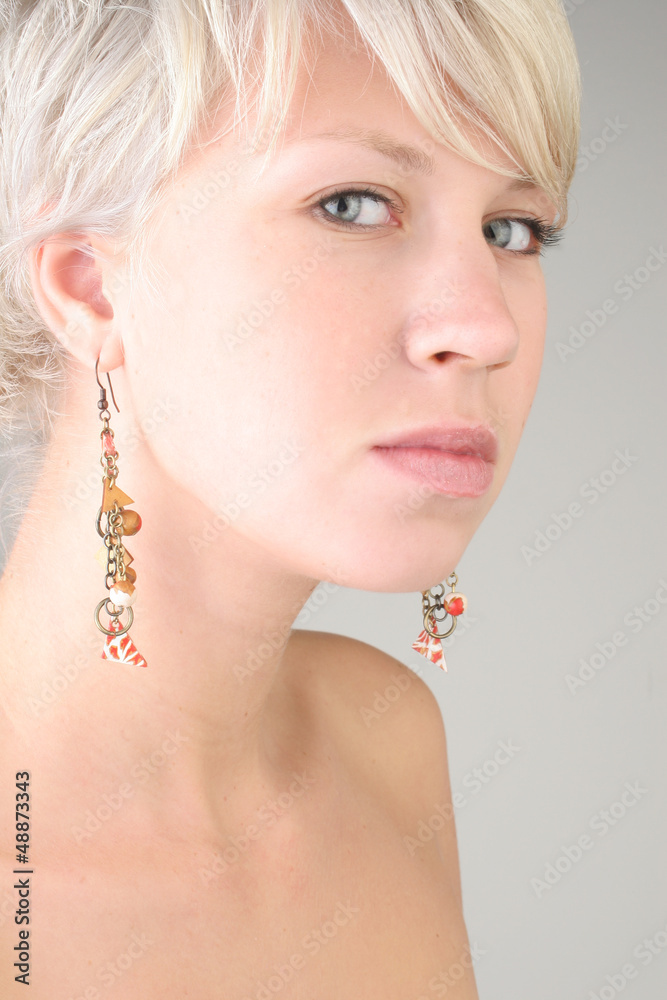 Portrait of blonde girl with earrings
