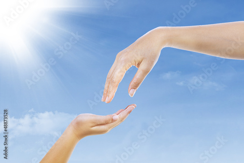 Give gesture under blue sky