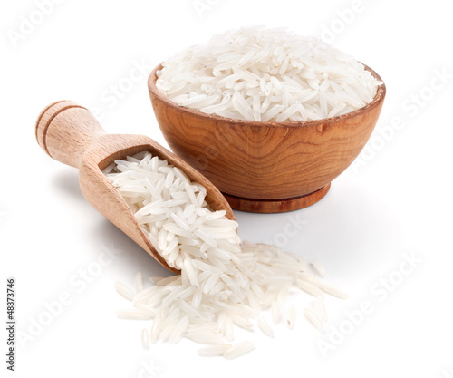 basmati rice in a wooden bowl isolated on white