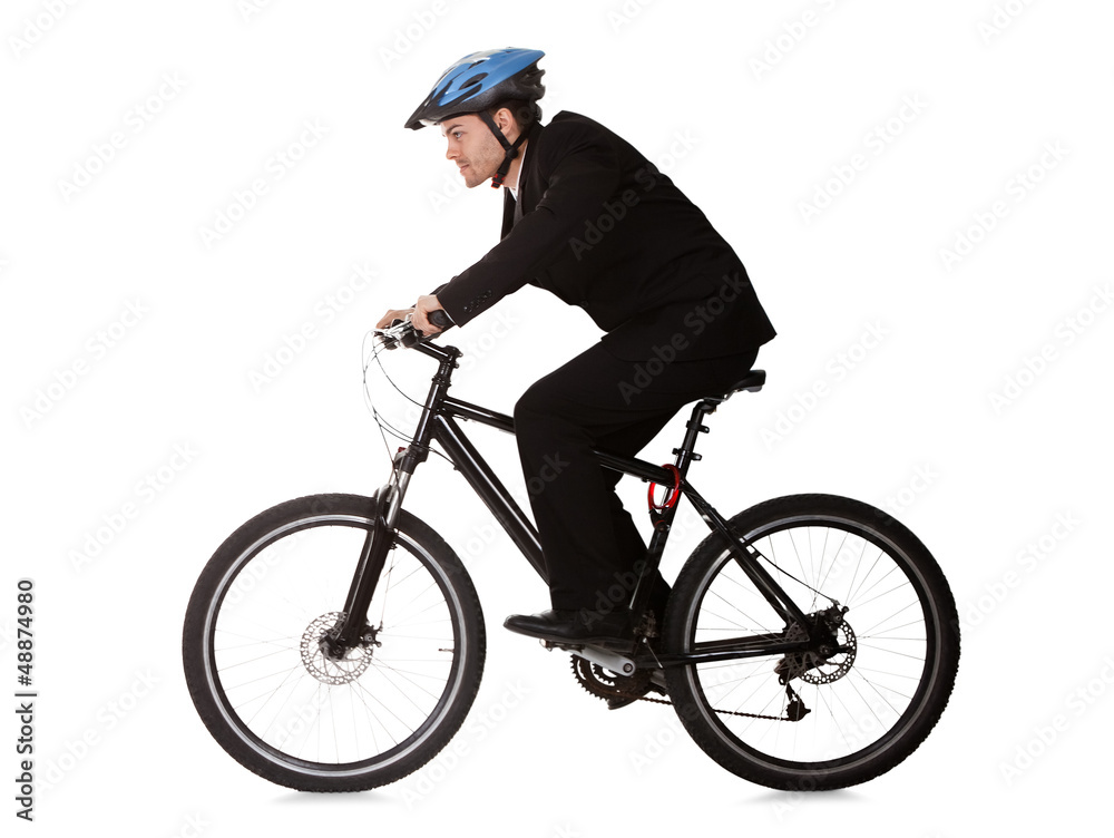 Obraz premium Businessman riding a bicycle