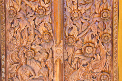 Wood carving decorated at windows of the temple, hand made by Th