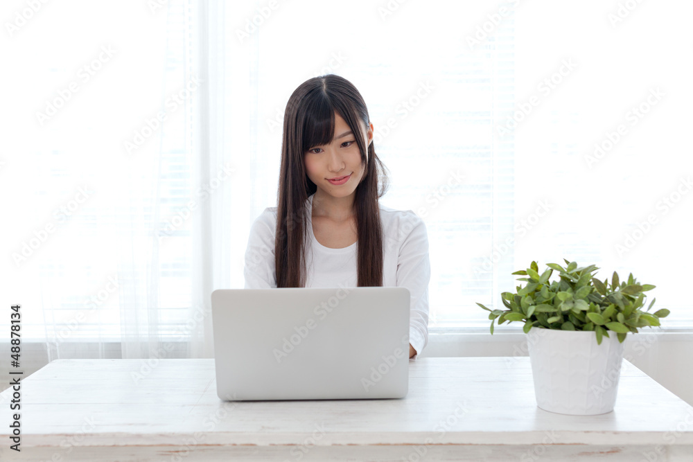 attractive asian woman using laptop attractive asian woman using laptop