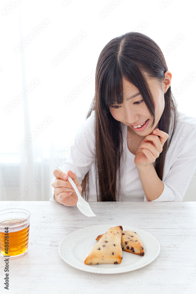 attractive asian woman eating sweets attractive asian woman eating sweets