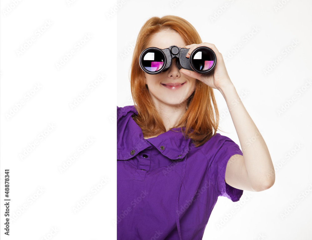 Teen red-haired girl with binoculars isolated on white backgroun Teen red-haired girl with binoculars isolated on white backgroun