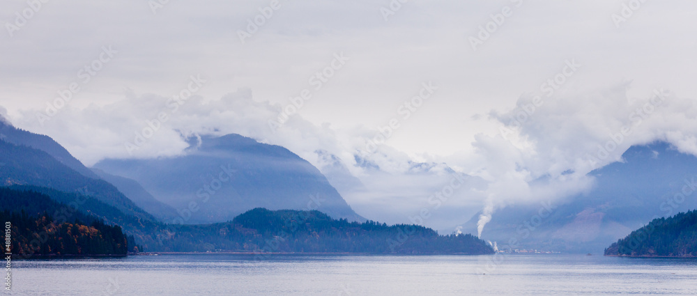 Rain clouds on coastal mountain ranges BC Canada