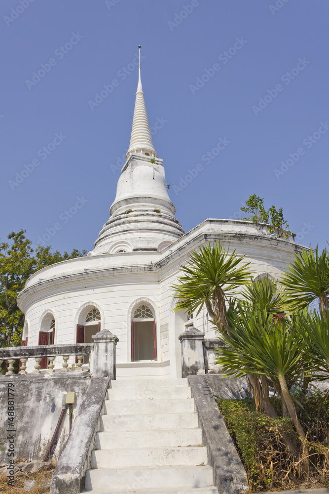 Historic white stupa in thailand, against blue sky Historic white stupa in thailand, against blue sky