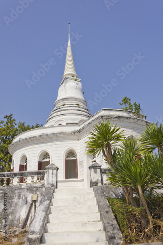 Historic white stupa in thailand  against blue sky