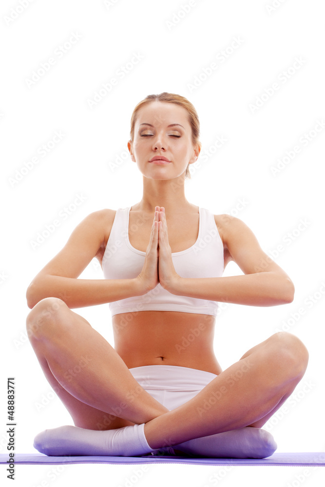 woman practicing yoga in lotus pose woman practicing yoga in lotus pose