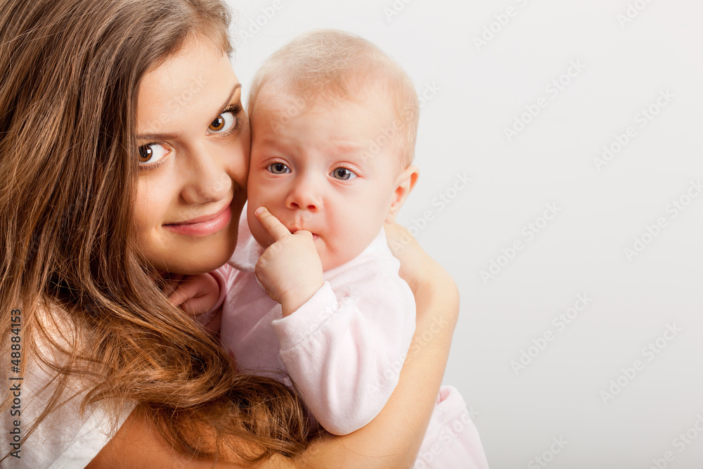 young mother holding her baby girl on hands young mother holding her baby girl on hands
