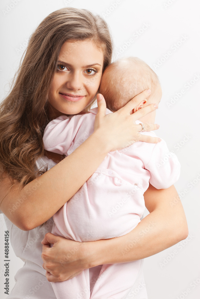 young mother  holding her baby girl on hands