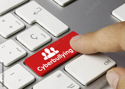 Cyberbullying keyboard key. Finger