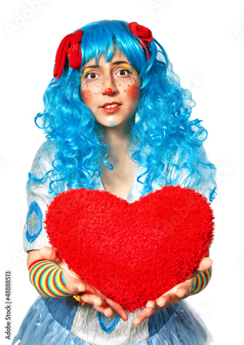 Clown girl holding heart photo