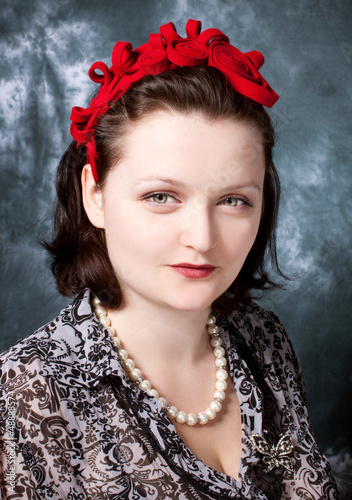 woman wearing red felt adornment in retro style looking  .incr photo