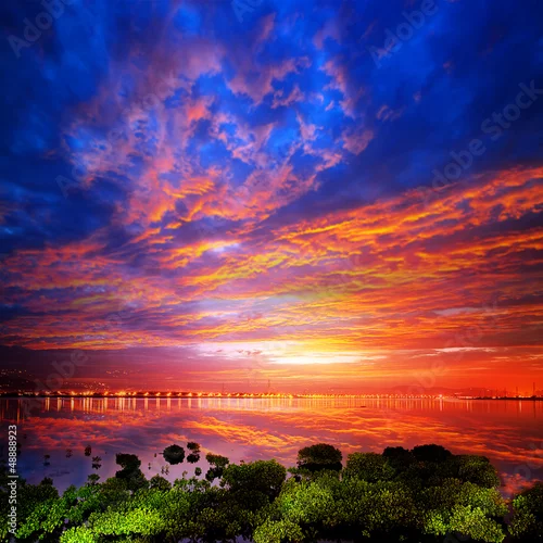 Obraz jasny wschód słońca nad rzeką