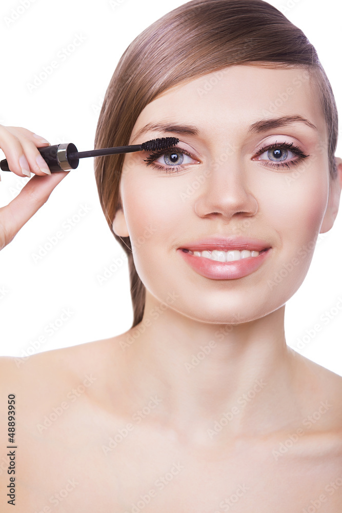 pretty woman with mascara brush