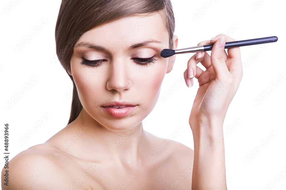 sexy woman with cosmetic brush on eye sexy woman with cosmetic brush on eye