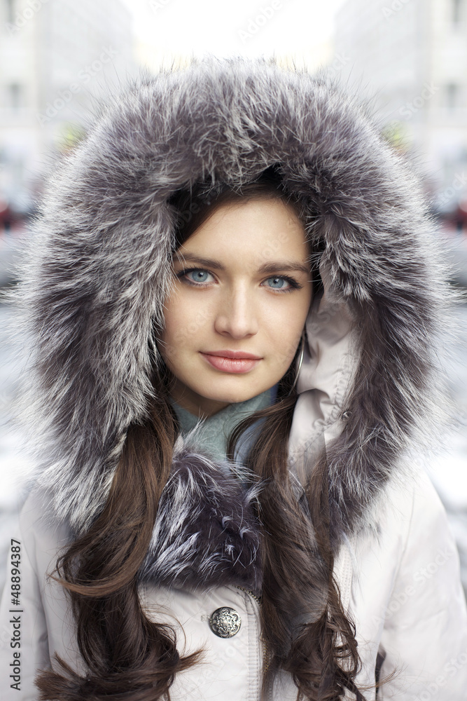 Portrait of a young woman on the background of a winter city Portrait of a young woman on the background of a winter city