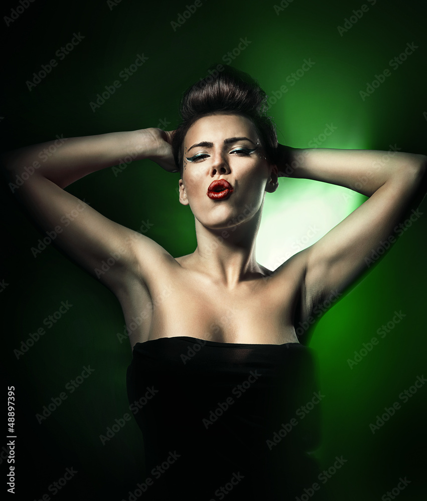 hot beautiful woman with red lips in dark green light hot beautiful woman with red lips in dark green light
