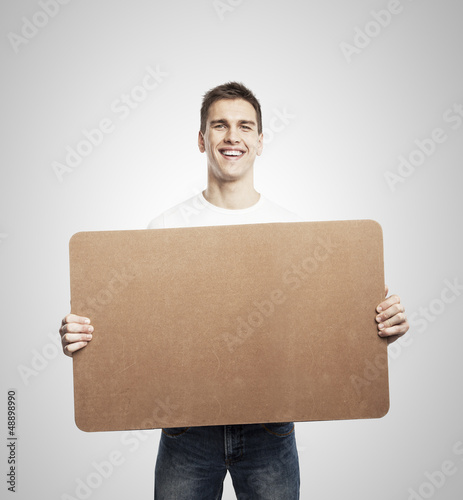 man holding poster