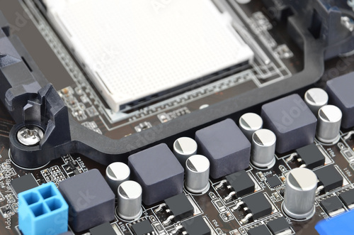 Printed computer motherboard board with microcircuit, close-up