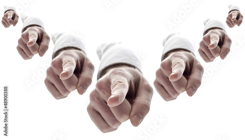 Fotografie Many hands pointing finger at you