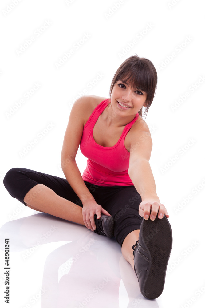 Fitness woman stretching her leg to warm up Fitness woman stretching her leg to warm up