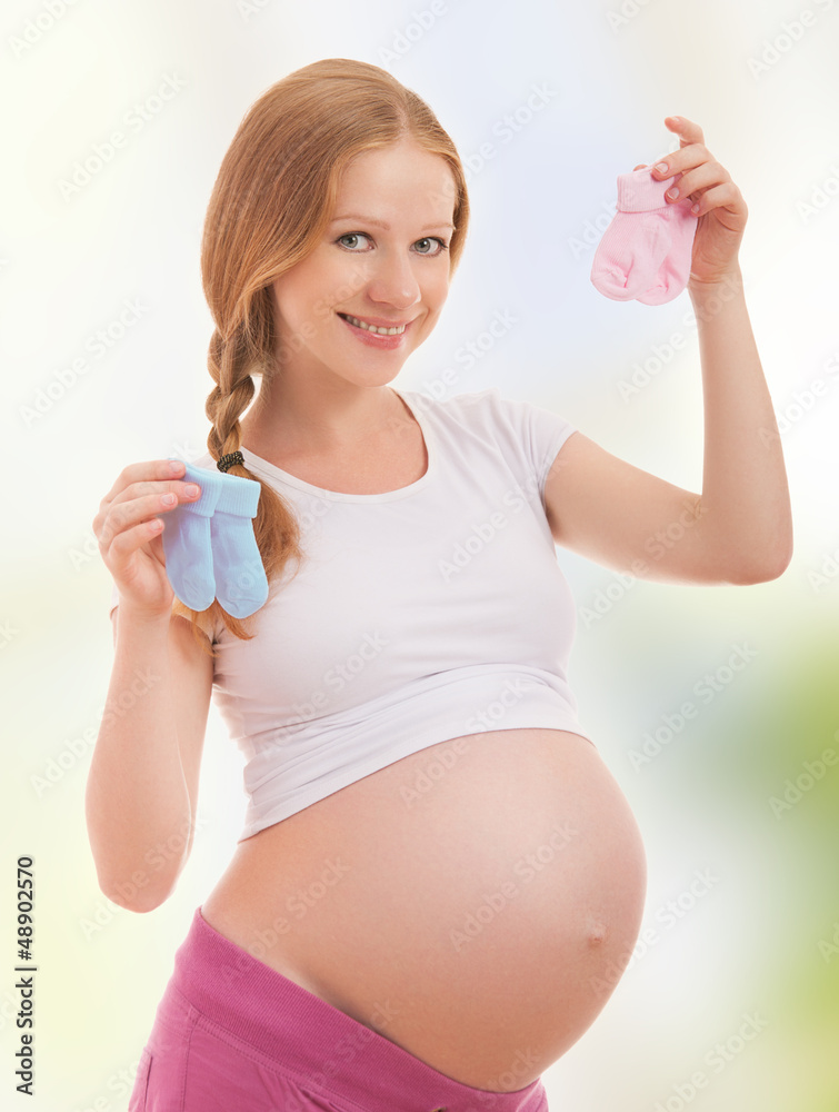 happy pregnant woman and pink socks