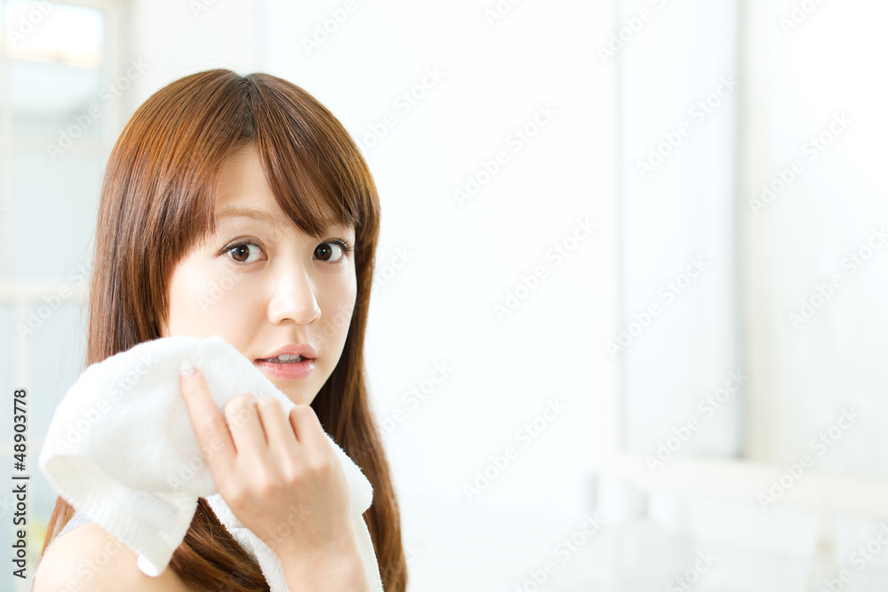 Beautiful asian woman relaxing in the bathroom Beautiful asian woman relaxing in the bathroom