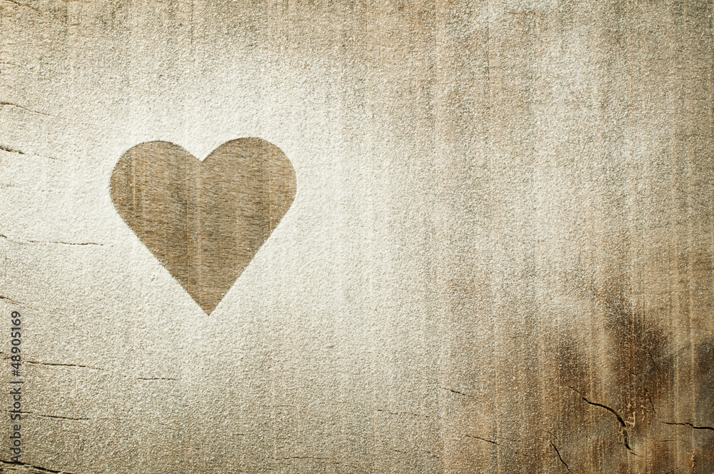 Heart pattern on an old wooden board Heart pattern on an old wooden board