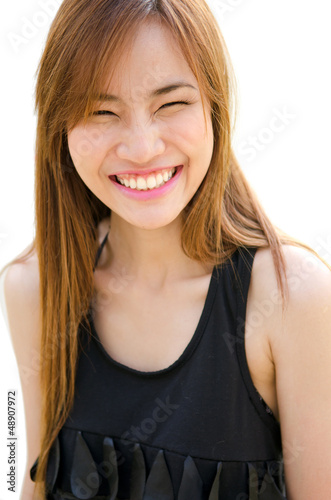Beautiful Asian woman laughing.