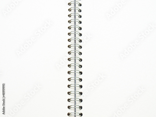 open spiral binding notebook on white