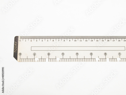 Closeup of used plastic ruler isolated on white background