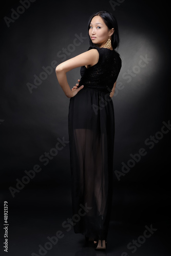 Asian woman in black dress