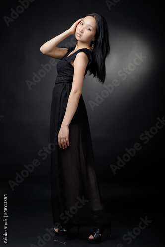 Asian woman in black dress